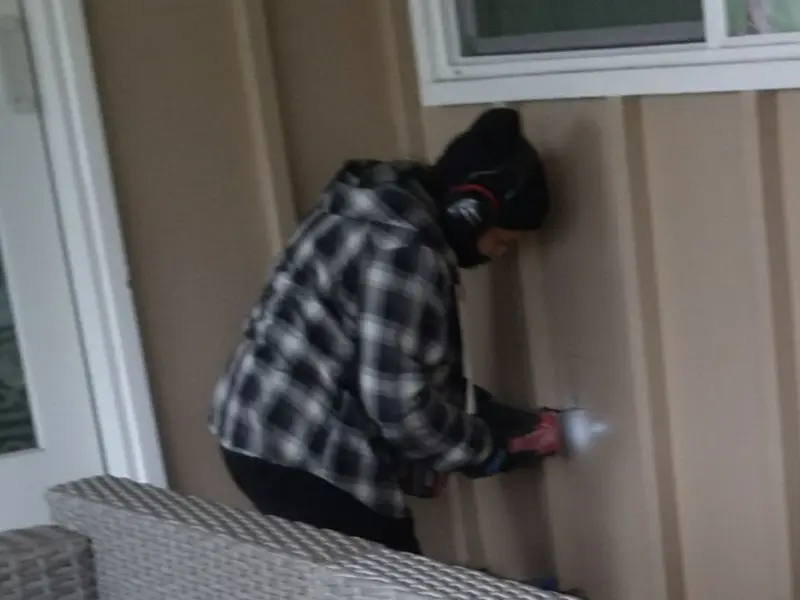 Professional electrician installing an exterior outlet in Rolla