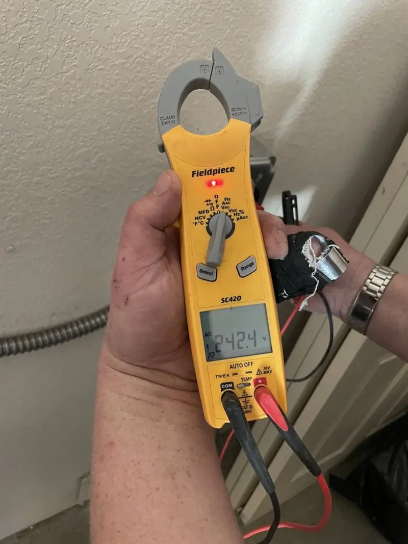 Voltage testing with clamp meter during Ceiling Fan Installation in Rolla